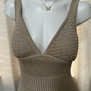 One of a kind dress with golden accents.